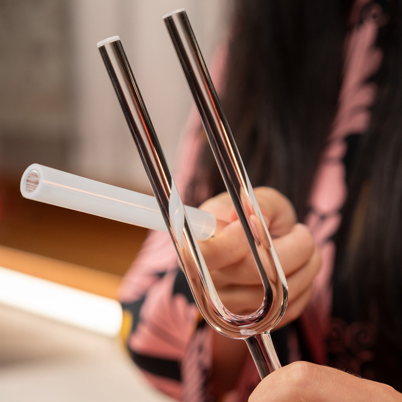 Quartz Crystal Tuning Fork in Hand for Sound Healing and Meditation